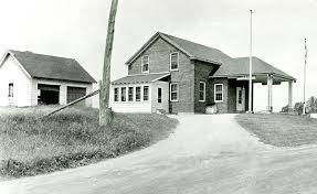 1940's photograph of the U.S. Customs and U.S. Immigration border inspection station at Morses Line, Vt. The border station was built in 1935 on the west side of Morses Line Road (State Route 235), and contained a small office on the first floor plus residential quarters for the Customs and Immigration officers stationed at the port.